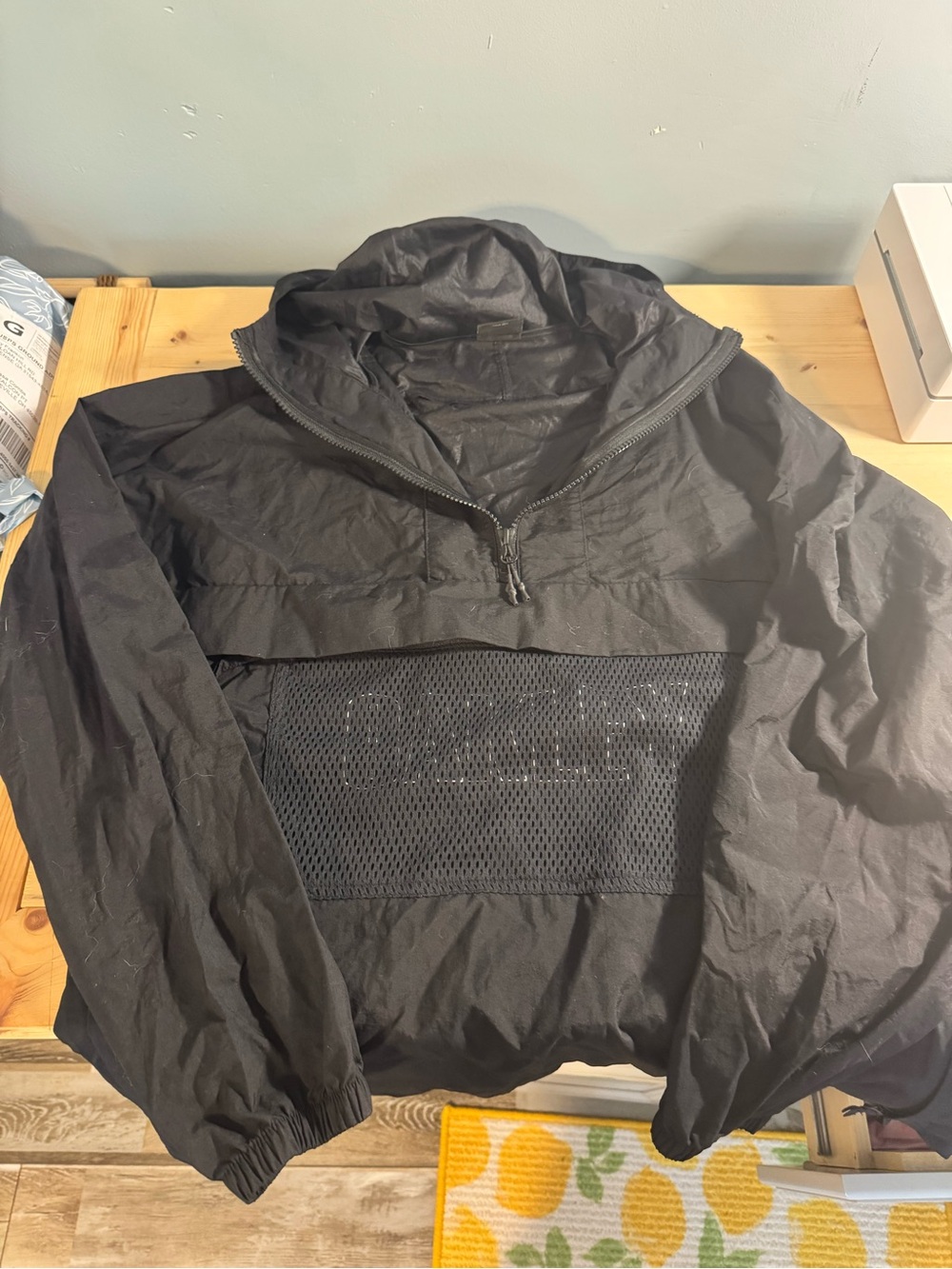 The Oakley Performance Fit Black Hooded 1/4 Zip Windbreaker Jacket